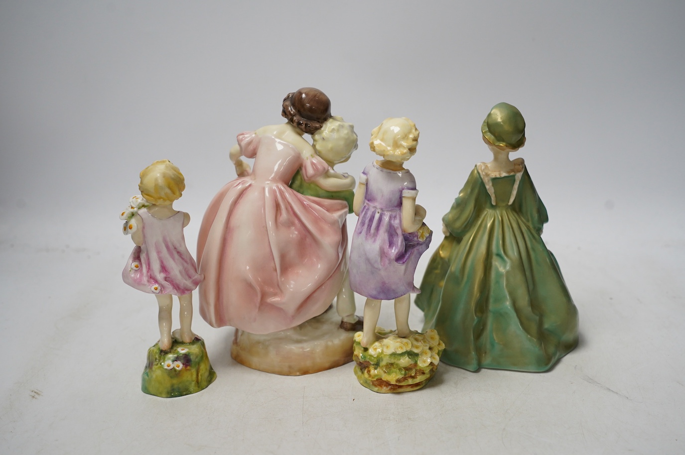 Four Worcester Doughty figurines including 'The First Cuckoo', 'Sister' and 'Grandmothers Dress', 18cm high. Condition - good